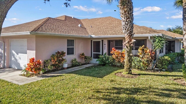 single story home featuring a garage, stucco siding, a front yard, and roof with shingles