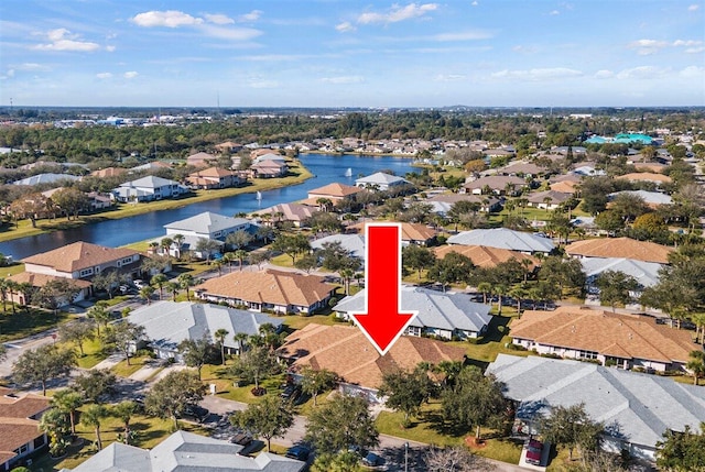 bird's eye view with a residential view and a water view