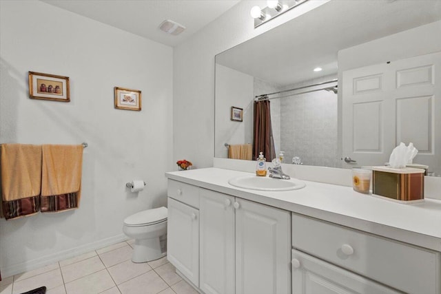 bathroom featuring toilet, curtained shower, tile patterned floors, and vanity