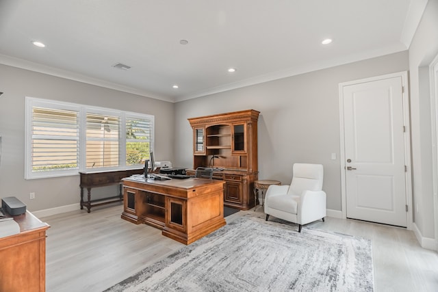 office featuring light wood-type flooring and crown molding