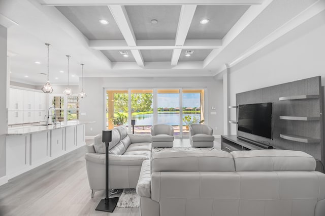 living room featuring beam ceiling, light wood-type flooring, a wealth of natural light, and coffered ceiling