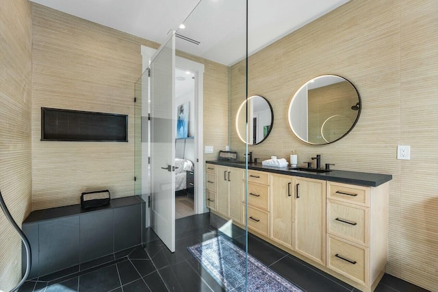 bathroom with tile walls, vanity, and tile patterned floors