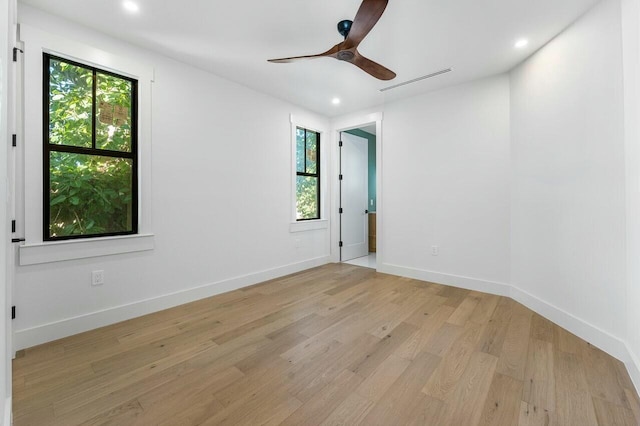 unfurnished room with ceiling fan and light hardwood / wood-style flooring