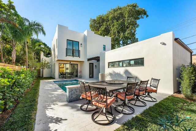 back of house featuring a patio area