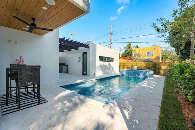 view of pool featuring ceiling fan, a pergola, a patio, and pool water feature