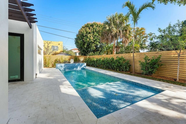 view of swimming pool with a patio and pool water feature