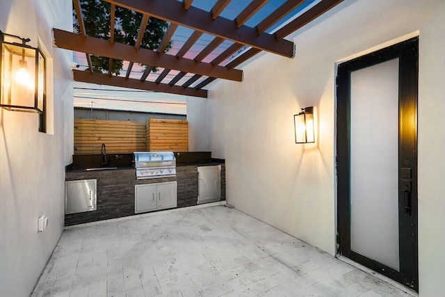 view of patio featuring sink, exterior kitchen, a pergola, and a grill