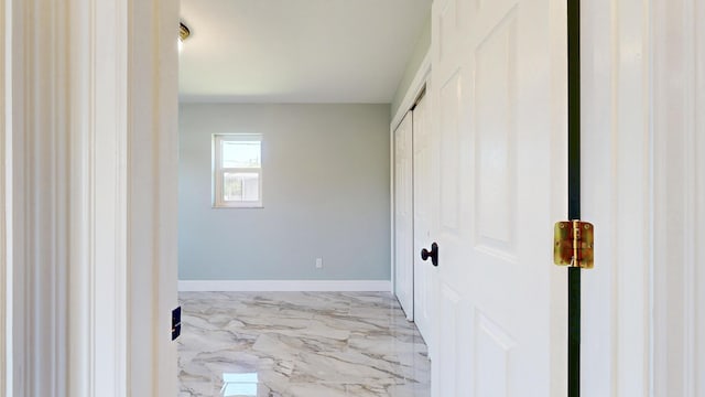601 SE Karrigan Ter, Port Saint Lucie, FL 34983 - hallway with light marble finish floors and baseboards