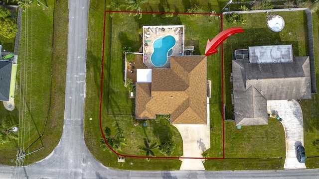 601 SE Karrigan Ter, Port Saint Lucie, FL 34983 - aerial view of property's location with property parcel outlined and a pool area