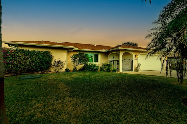 601 SE Karrigan Ter, Port Saint Lucie, FL 34983 - single story home featuring stucco siding, a garage, a front yard, and driveway