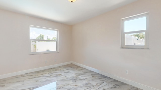 601 SE Karrigan Ter, Port Saint Lucie, FL 34983 - unfurnished room with light marble finish floors and baseboards