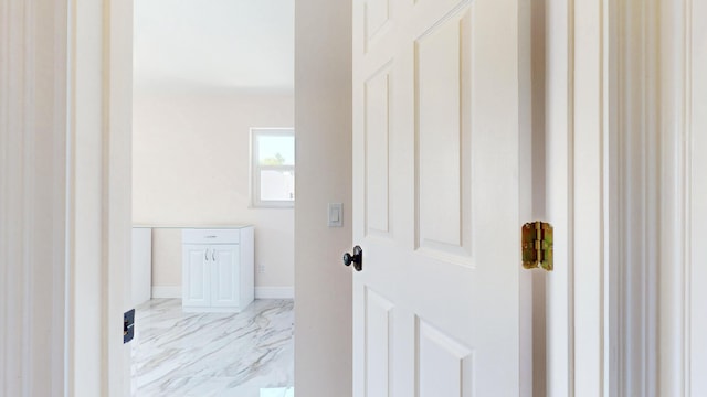 601 SE Karrigan Ter, Port Saint Lucie, FL 34983 - bathroom featuring marble finish flooring and baseboards