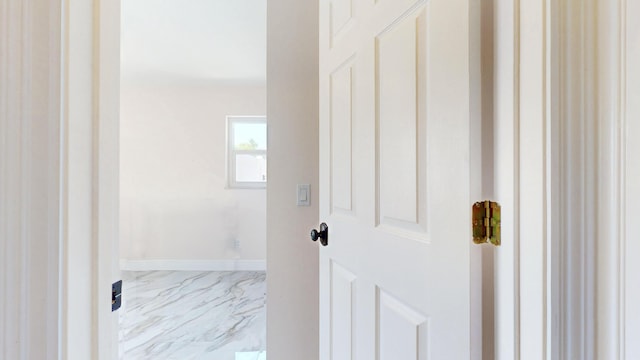 601 SE Karrigan Ter, Port Saint Lucie, FL 34983 - corridor featuring marble finish floors and baseboards