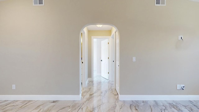 601 SE Karrigan Ter, Port Saint Lucie, FL 34983 - unfurnished room featuring light marble finish floors and arched walkways