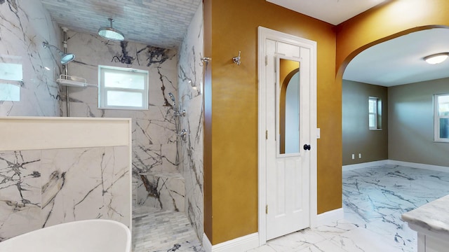 601 SE Karrigan Ter, Port Saint Lucie, FL 34983 - bathroom with a marble finish shower, marble finish floors, healthy amount of natural light, and a soaking tub
