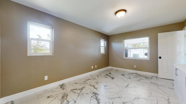 601 SE Karrigan Ter, Port Saint Lucie, FL 34983 - unfurnished room with baseboards and light marble finish floors