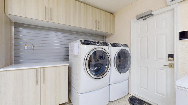 601 SE Karrigan Ter, Port Saint Lucie, FL 34983 - laundry room featuring separate washer and dryer, cabinet space, and a wall mounted AC