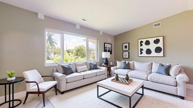 601 SE Karrigan Ter, Port Saint Lucie, FL 34983 - living area with baseboards and vaulted ceiling