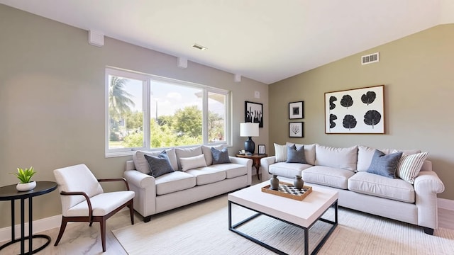 601 SE Karrigan Ter, Port Saint Lucie, FL 34983 - living area featuring baseboards and vaulted ceiling