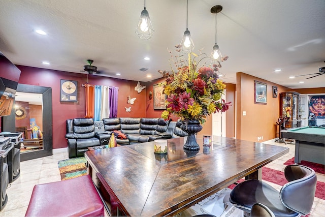 dining area featuring a textured ceiling, ceiling fan, and billiards