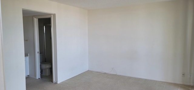 2425 Presidential Way Unit 402, West Palm Beach, FL 33401 - empty room featuring light carpet and baseboards