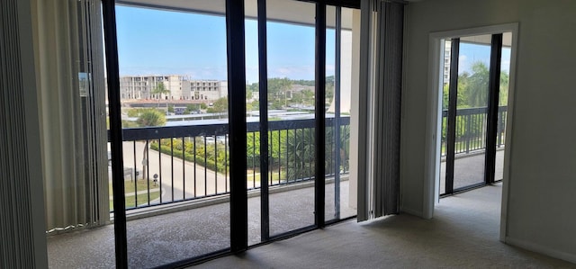 2425 Presidential Way Unit 402, West Palm Beach, FL 33401 - entryway with carpet floors