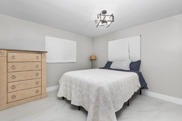 bedroom featuring a chandelier