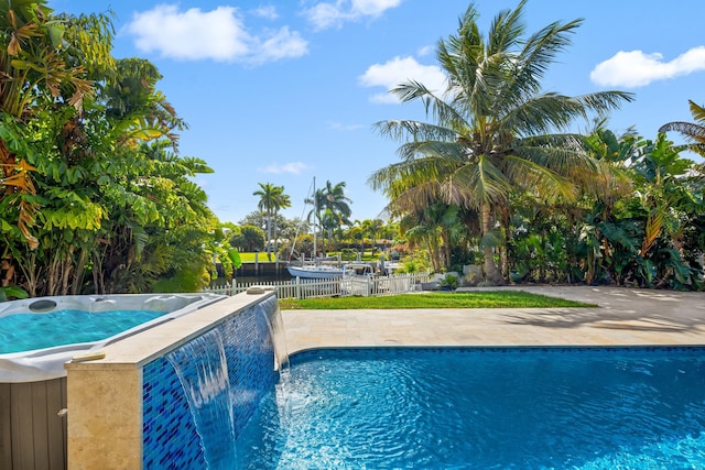 view of swimming pool featuring pool water feature