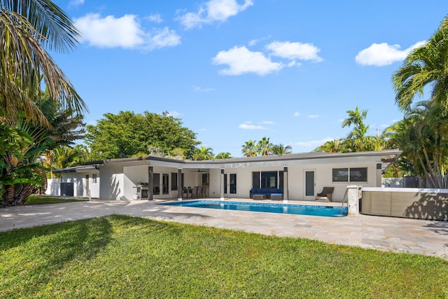 view of swimming pool featuring an outdoor hangout area, a patio, ceiling fan, and a yard