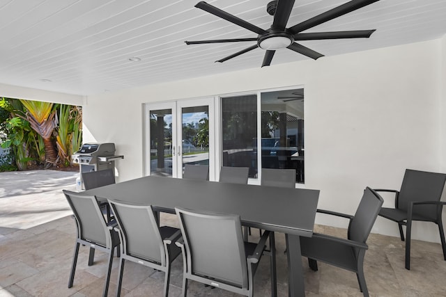 view of patio with ceiling fan and a grill