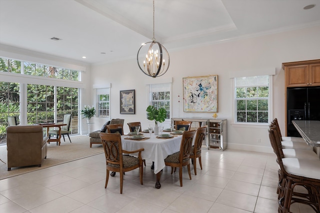 dining room with crown molding, plenty of natural light, a chandelier, and light tile patterned floors