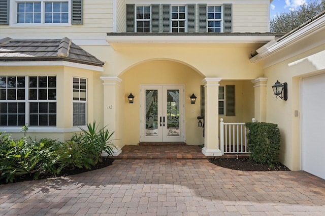 view of exterior entry featuring french doors