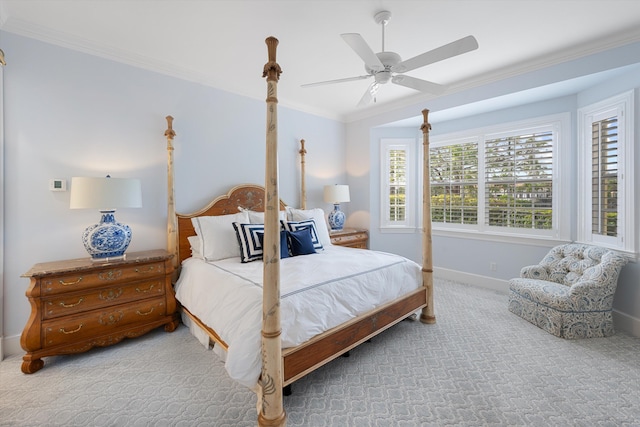 carpeted bedroom with crown molding and ceiling fan