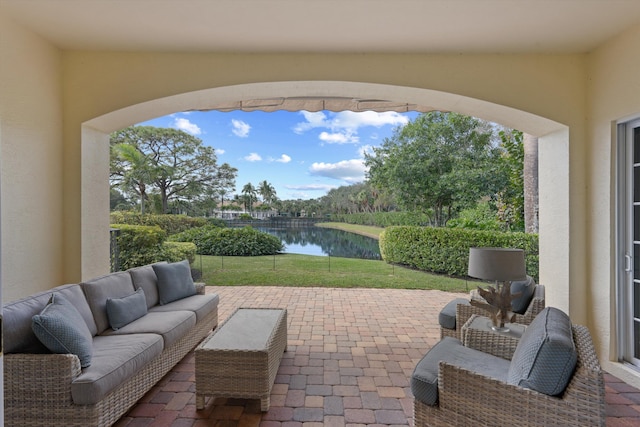 view of patio / terrace with a water view and an outdoor hangout area