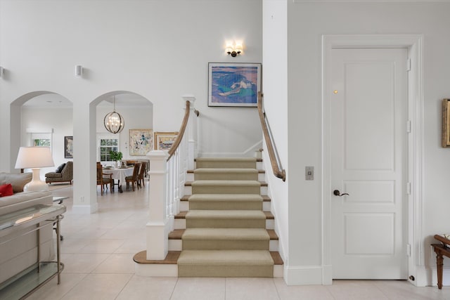 stairs with tile patterned flooring