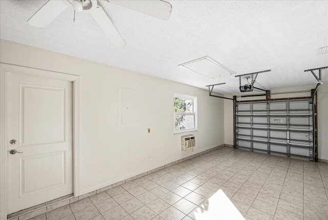 garage with a garage door opener, ceiling fan, and heating unit