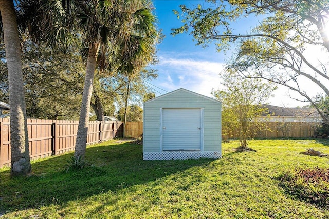 view of outbuilding with a lawn