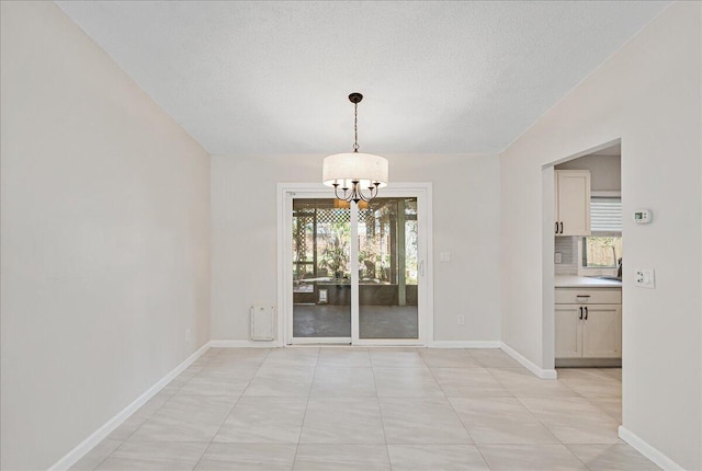 unfurnished dining area with a notable chandelier and light tile patterned floors