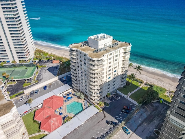 bird's eye view featuring a view of the beach and a water view