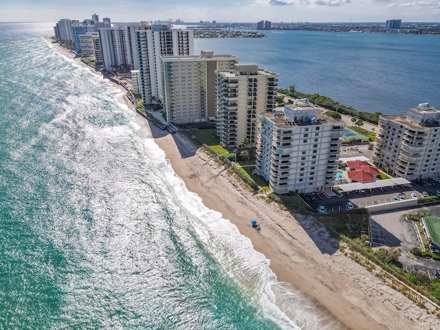 birds eye view of property featuring a view of the beach and a water view