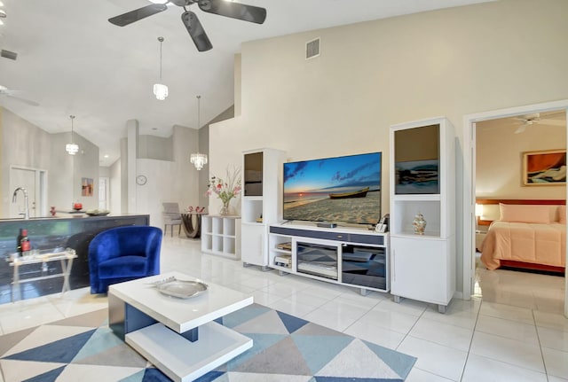 tiled living room featuring sink and high vaulted ceiling