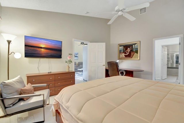 bedroom with ensuite bath and ceiling fan