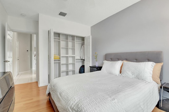 bedroom featuring a closet and wood-type flooring