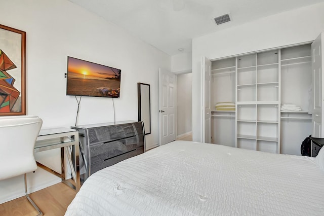 bedroom featuring a closet and hardwood / wood-style floors