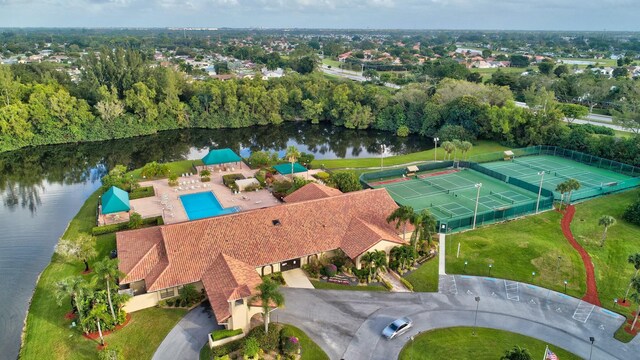 birds eye view of property with a water view