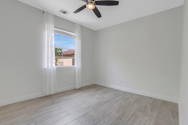 empty room featuring ceiling fan and light hardwood / wood-style flooring