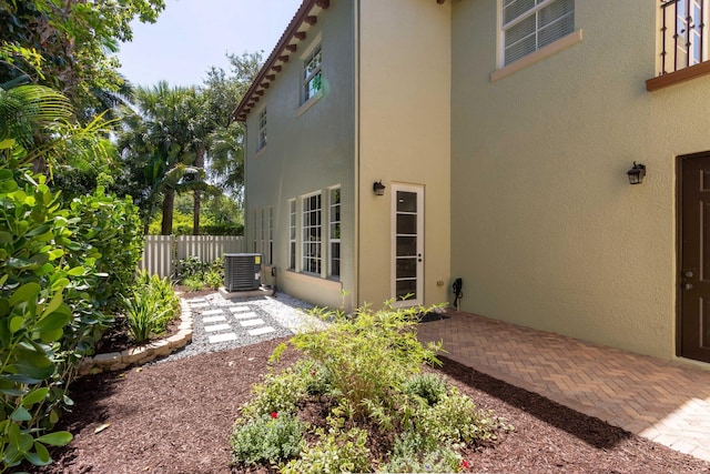 exterior space with a patio area and central AC