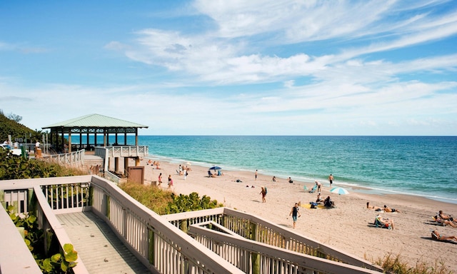 view of water feature featuring a view of the beach and a gazebo