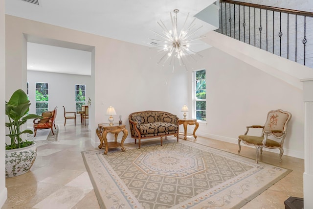 living area featuring an inviting chandelier