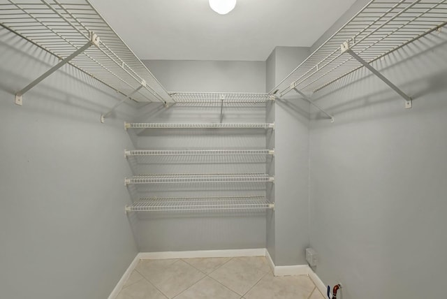 walk in closet featuring tile patterned floors